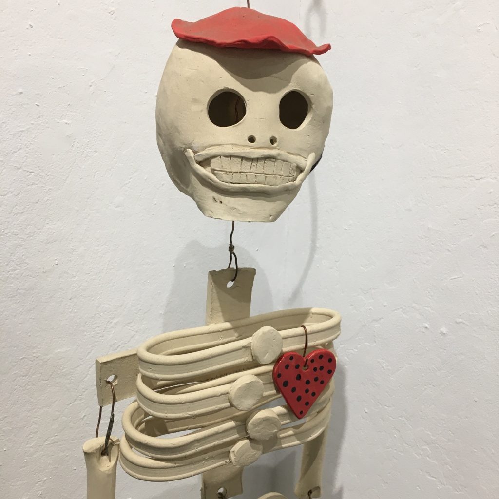 ERIN WELLS,
"Distant Cousin, Erik the Red", ceramic and copper wire, $400. Many of us choose to celebrate our heritage and past family during this time of the year... My family is very northern European, but we do have our heros and they can be part of the ofrenda of our more Mediterranean Brothers and Sisters. I love to honor the dead with a bit of humor and a more relaxed vision of life beyond.