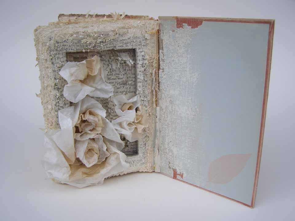 Claudia Berlinski, Speechless, 2012, Altered book with used coffee filters, 8" x 10" x 3", $250.

Speechless grew out of a repetitive cathartic striking of the book using an art knife during a particularly difficult period in my life. After passing through this period I created the flower-like forms that emerge from the tattered book as an analogy for surviving and healing after that experience.