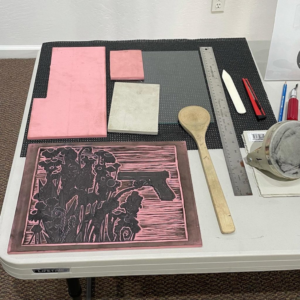 Marisa Segovia's work table with linocut materials